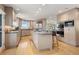 Bright, updated kitchen with stainless steel appliances, island, and scenic views from window at 1621 Baneberry Ln, Golden, CO 80401