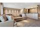 Basement living room with bar, sofa, and plush carpet at 1621 Baneberry Ln, Golden, CO 80401