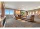 Cozy living room with plush seating, mountain views, and recessed lighting at 1621 Baneberry Ln, Golden, CO 80401