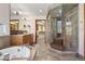 Luxurious bath boasts a soaking tub, glass shower, double vanity, and walk-in closet at 1621 Baneberry Ln, Golden, CO 80401