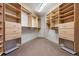 Spacious walk-in closet featuring custom shelving and ample storage space at 1621 Baneberry Ln, Golden, CO 80401