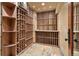 Climate-controlled wine cellar with custom wood racking and tile floors at 1621 Baneberry Ln, Golden, CO 80401