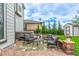 Backyard patio area with comfortable seating, a fire pit, hot tub, and a storage shed at 12330 Village E Cir, Commerce City, CO 80603