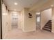 Basement area with sliding barn doors leading to adjacent rooms and a stairway at 12330 Village E Cir, Commerce City, CO 80603