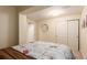 Bright bedroom with Parisian-themed decor and closet with sliding doors providing ample storage at 12330 Village E Cir, Commerce City, CO 80603