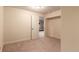 Neutral bedroom with a standard closet and door, ample lighting and carpet flooring at 12330 Village E Cir, Commerce City, CO 80603