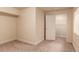 Neutral bedroom with a closet leading to a wire shelving, ample lighting and space at 12330 Village E Cir, Commerce City, CO 80603