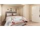 Bright bedroom featuring a comfortable bed with Parisian-themed decor and ample closet space at 12330 Village E Cir, Commerce City, CO 80603