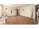 Spacious bonus room, featuring a desk, rocking chair, and ample room for various activities at 12330 Village E Cir, Commerce City, CO 80603