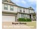 Charming two-story home with a spacious two-car garage and beautifully maintained landscaping at 12330 Village E Cir, Commerce City, CO 80603
