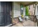 Charming porch with seating offers a cozy spot with a lockbox for added security at 12330 Village E Cir, Commerce City, CO 80603