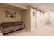 Cozy living room with comfortable seating and stylish sliding barn doors for added charm at 12330 Village E Cir, Commerce City, CO 80603