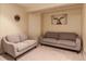Comfortable living room with plush seating and artwork creating a relaxing atmosphere at 12330 Village E Cir, Commerce City, CO 80603