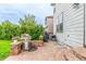 Back patio with a built-in grill and ample space for outdoor cooking and entertaining at 12330 Village E Cir, Commerce City, CO 80603