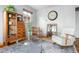 Cozy living room with a vintage hutch and hardwood floors at 875 S Dale Ct, Denver, CO 80219