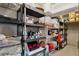 Well-organized basement storage with shelving, bins, and ample space for storing belongings and household items at 301 Garfield St # 1E, Denver, CO 80206
