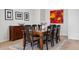 Dining room with table and chairs and decorated with tasteful art at 301 Garfield St # 1E, Denver, CO 80206