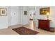 Stylish entryway with hardwood flooring, a decorative rug, and a glimpse into other rooms at 301 Garfield St # 1E, Denver, CO 80206