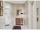Elegant foyer with black and white tile, traditional wood accents, and access to an elevator at 301 Garfield St # 1E, Denver, CO 80206