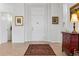 Bright foyer featuring light hardwood floors, white walls, and a traditional rug, creating a welcoming entrance at 301 Garfield St # 1E, Denver, CO 80206