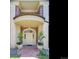 Inviting front entrance with brick accents, manicured greenery, and decorative planters at 301 Garfield St # 1E, Denver, CO 80206