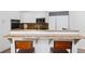 Kitchen with granite countertops, white cabinets, and stainless steel appliances at 301 Garfield St # 1E, Denver, CO 80206