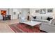 Bright living room features elegant decor, hardwood floors, and an inviting seating arrangement at 301 Garfield St # 1E, Denver, CO 80206
