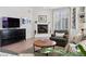 Cozy living room with fireplace, neutral decor, and large window, offering a comfortable space at 301 Garfield St # 1E, Denver, CO 80206