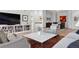 Open concept living room with hardwood floors and neutral color palette at 301 Garfield St # 1E, Denver, CO 80206