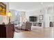 Bright living room with large windows, built-in shelving, and comfortable seating arrangement at 301 Garfield St # 1E, Denver, CO 80206