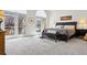 Bright bedroom with patio access, neutral carpet, and large windows for ample natural light at 301 Garfield St # 1E, Denver, CO 80206