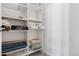 Spacious walk-in closet with multiple storage shelves and hanging racks at 301 Garfield St # 1E, Denver, CO 80206