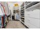 Walk-in closet featuring custom shelving and ample storage space for clothes and accessories at 301 Garfield St # 1E, Denver, CO 80206