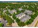 Aerial view showcases the lush landscaping and the layout of the community at 5155 W Quincy Ave # 101, Denver, CO 80236