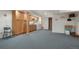 Spacious basement with laundry area, cabinets, and ample room for various activities at 5155 W Quincy Ave # 101, Denver, CO 80236