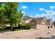 Attractive townhome complex with well-maintained landscaping and attached garages at 5155 W Quincy Ave # 101, Denver, CO 80236