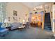 Spacious living room including comfortable seating, tall ceilings, and staircase at 5155 W Quincy Ave # 101, Denver, CO 80236