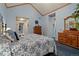 Comfortable main bedroom with blue walls, carpet, and ample closet space at 5155 W Quincy Ave # 101, Denver, CO 80236