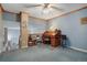 Upstairs office area features an antique wooden desk and comfortable seating area at 5155 W Quincy Ave # 101, Denver, CO 80236