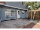 Private back patio with access from the unit. Features a concrete slab and small yard at 7396 S Knolls Way, Centennial, CO 80122