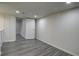 Bright basement space featuring gray flooring and white painted walls at 7396 S Knolls Way, Centennial, CO 80122