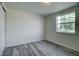Bedroom with a window, carpet, and modern light fixture at 7396 S Knolls Way, Centennial, CO 80122