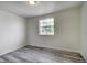 Bedroom featuring a window for natural light and a modern light fixture at 7396 S Knolls Way, Centennial, CO 80122