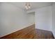 Open dining room boasts hardwood floors and stylish pendant lighting at 7396 S Knolls Way, Centennial, CO 80122