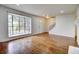 Bright living room boasts hardwood floors, large bay window and lots of natural light at 7396 S Knolls Way, Centennial, CO 80122