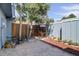 Small patio with mulch landscaping and wood fence at 7396 S Knolls Way, Centennial, CO 80122