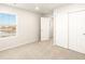 Bright bedroom with closet, window and neutral carpet at 6068 Corral St, Brighton, CO 80601