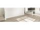 A living room with wood-look floors provides lots of space and light at 6068 Corral St, Brighton, CO 80601