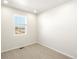 Cozy bedroom with carpet flooring, a window, and fresh white paint at 6068 Corral St, Brighton, CO 80601