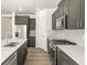 Stylish kitchen with gray cabinetry, stainless steel appliances, and granite countertops at 6068 Corral St, Brighton, CO 80601